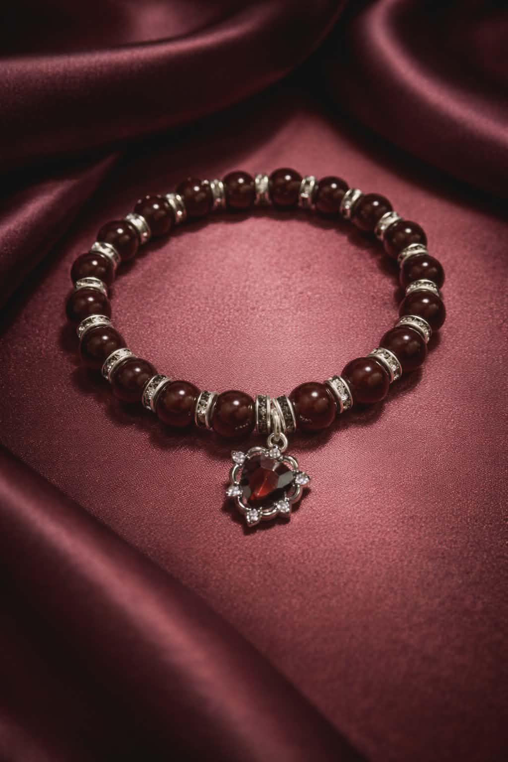 Dark Red beads with silver spacers and a red heart gem charm handcrafted glass bead bracelet