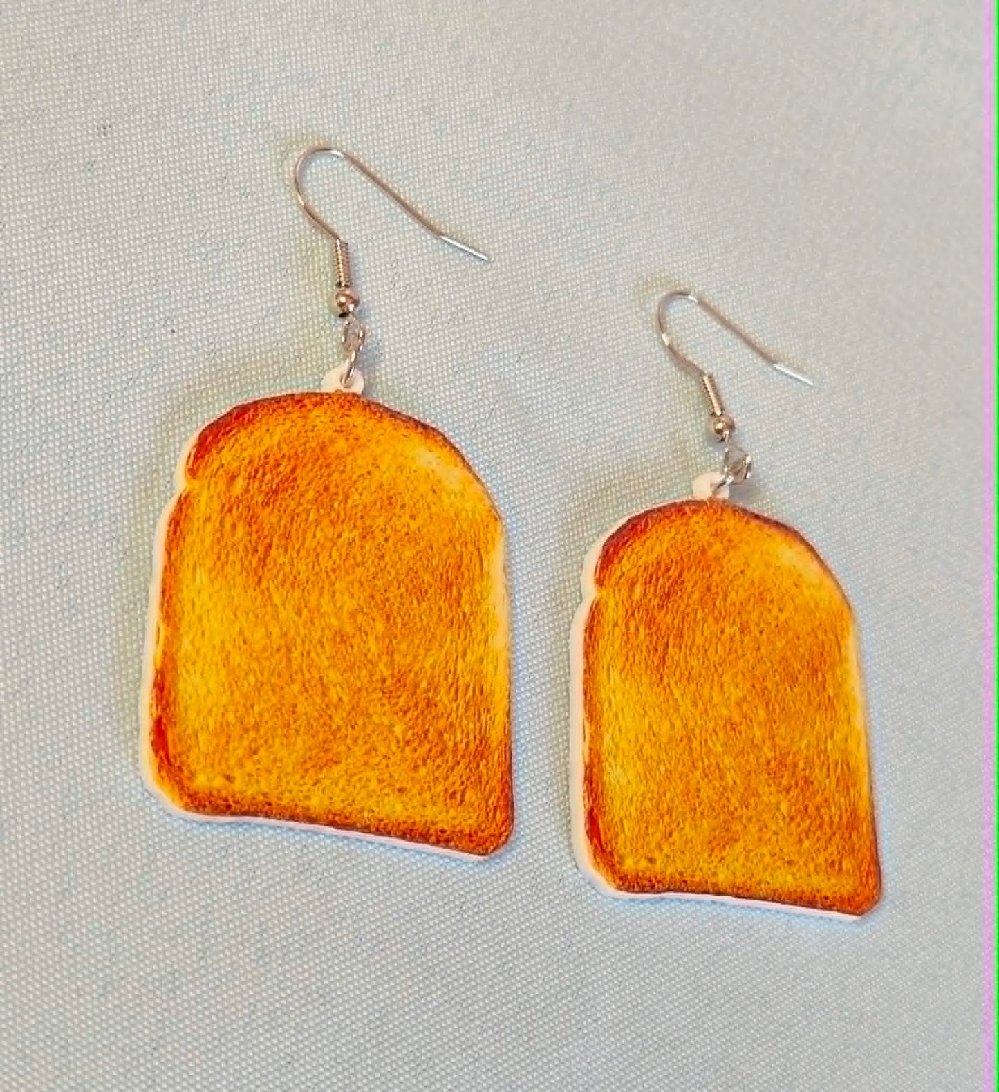Toast dangly earrings