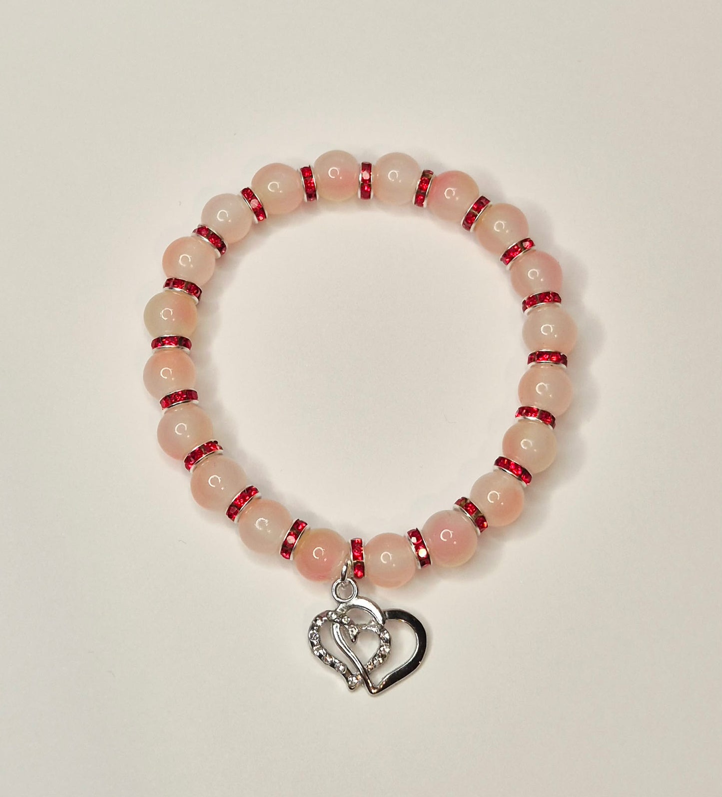 Two tone pink glass bead bracelet red spacers with sparkly twin heart charm