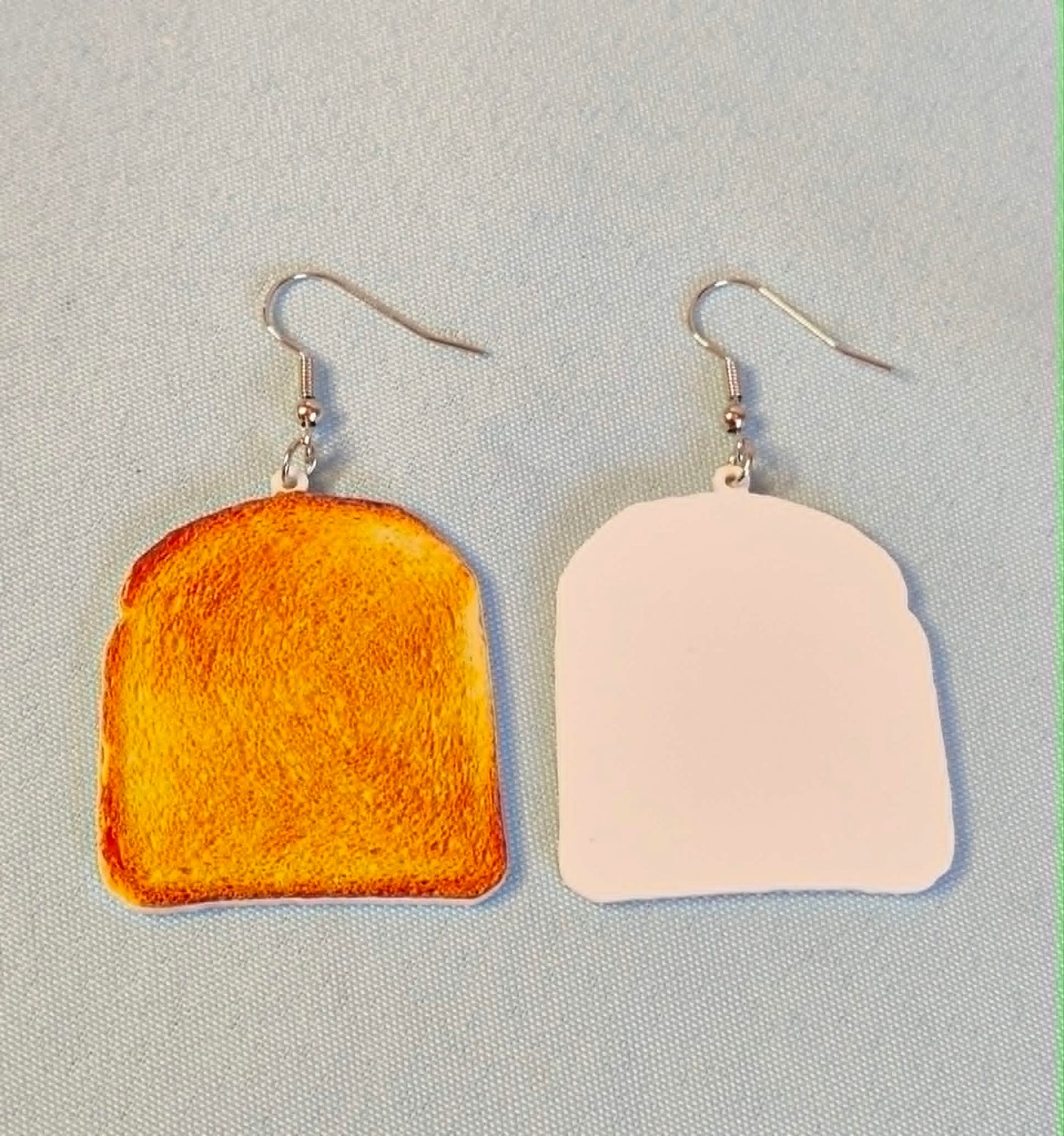 Toast dangly earrings