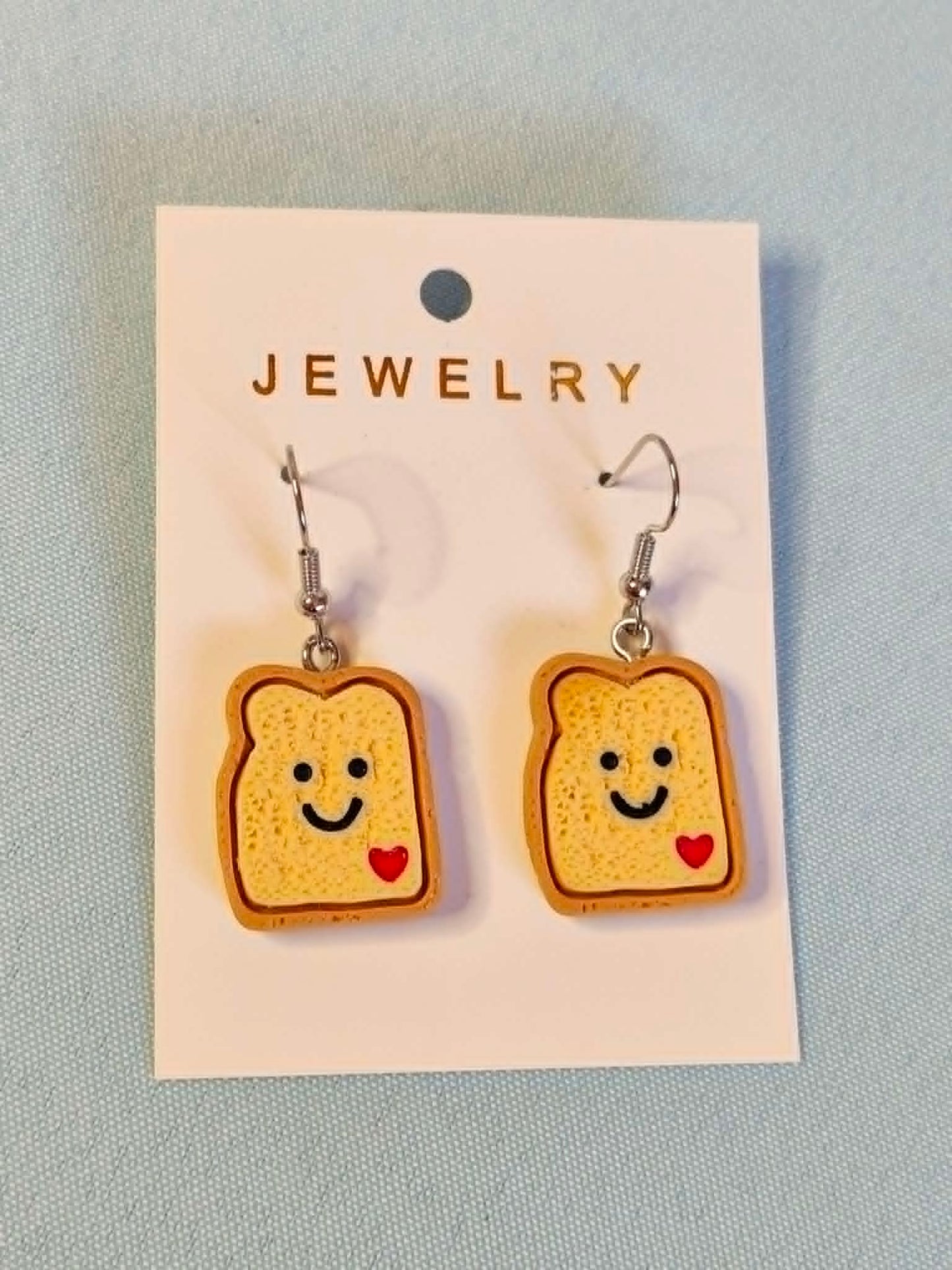 Smiley toast dangly earrings
