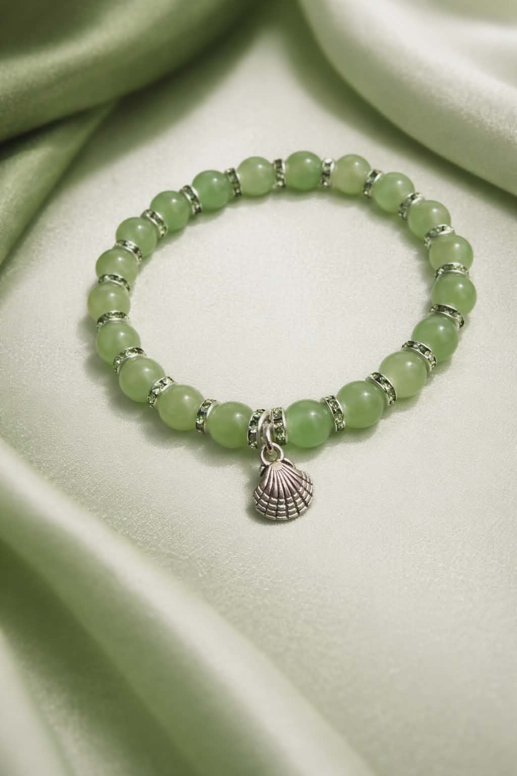 Green beads with green spacers and a seashell charm handcrafted glass bead bracelet (Copy)