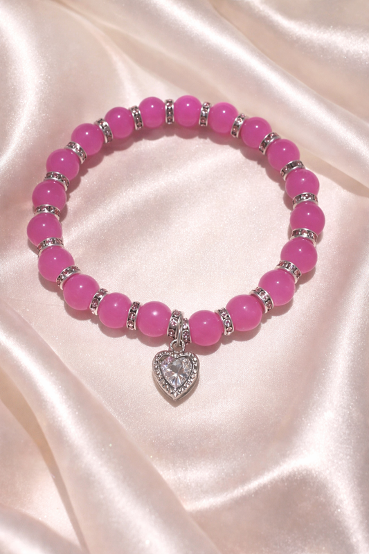 Pink glass bead bracelet with sparkly spacers and gem heart charm