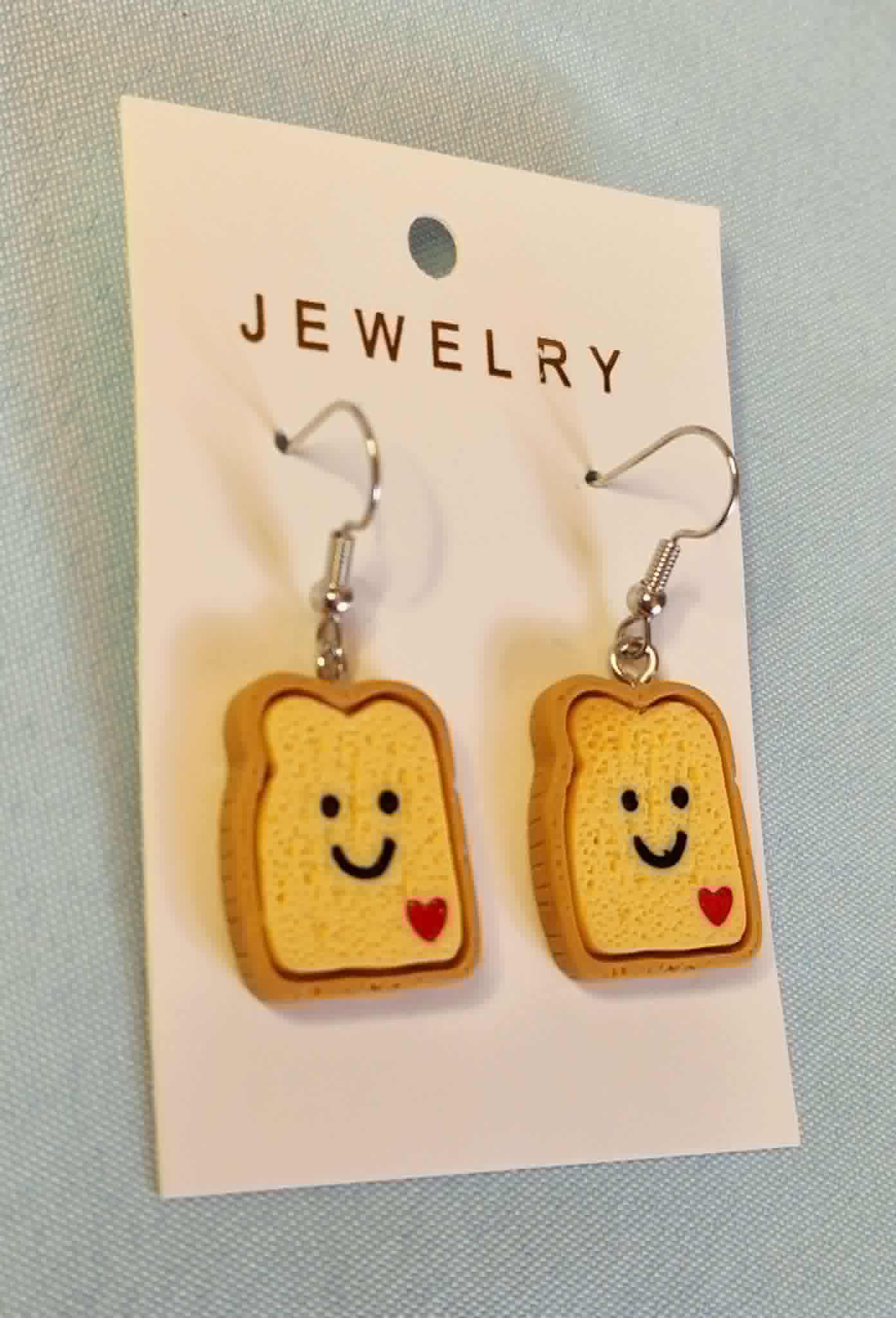 Smiley toast dangly earrings