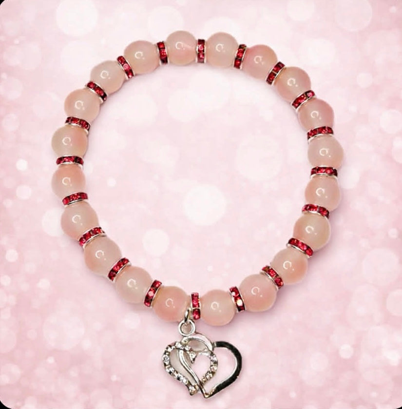 Two tone pink glass bead bracelet red spacers with sparkly twin heart charm