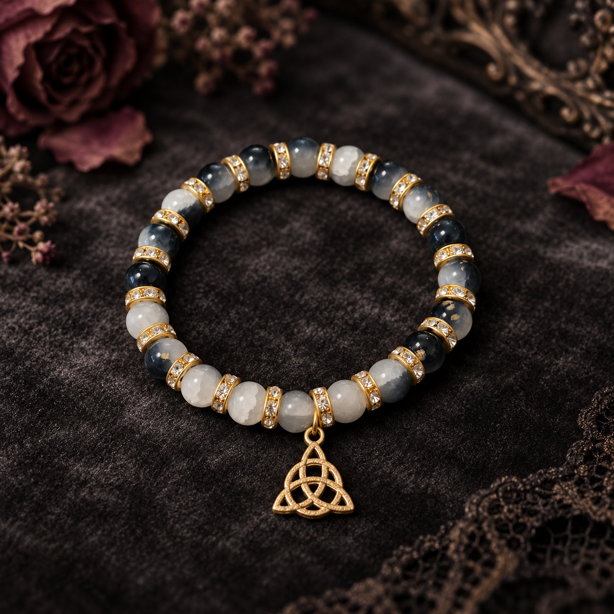 Black and white two tone beads with a gold charm handcrafted glass bead bracelet