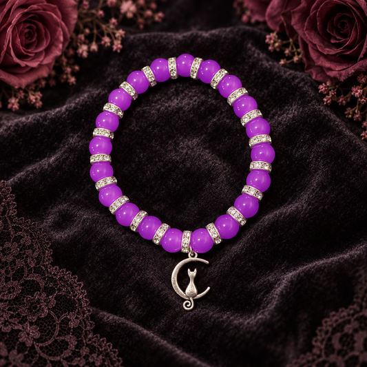 Purple glass bead bracelet with spacers and a moon with cat charm