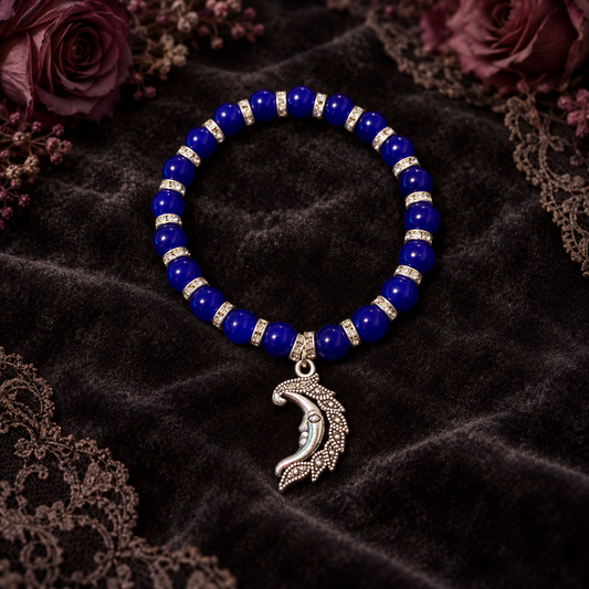 Dark Blue beads with silver spacers and a face in the moon charm handcrafted glass bead bracelet