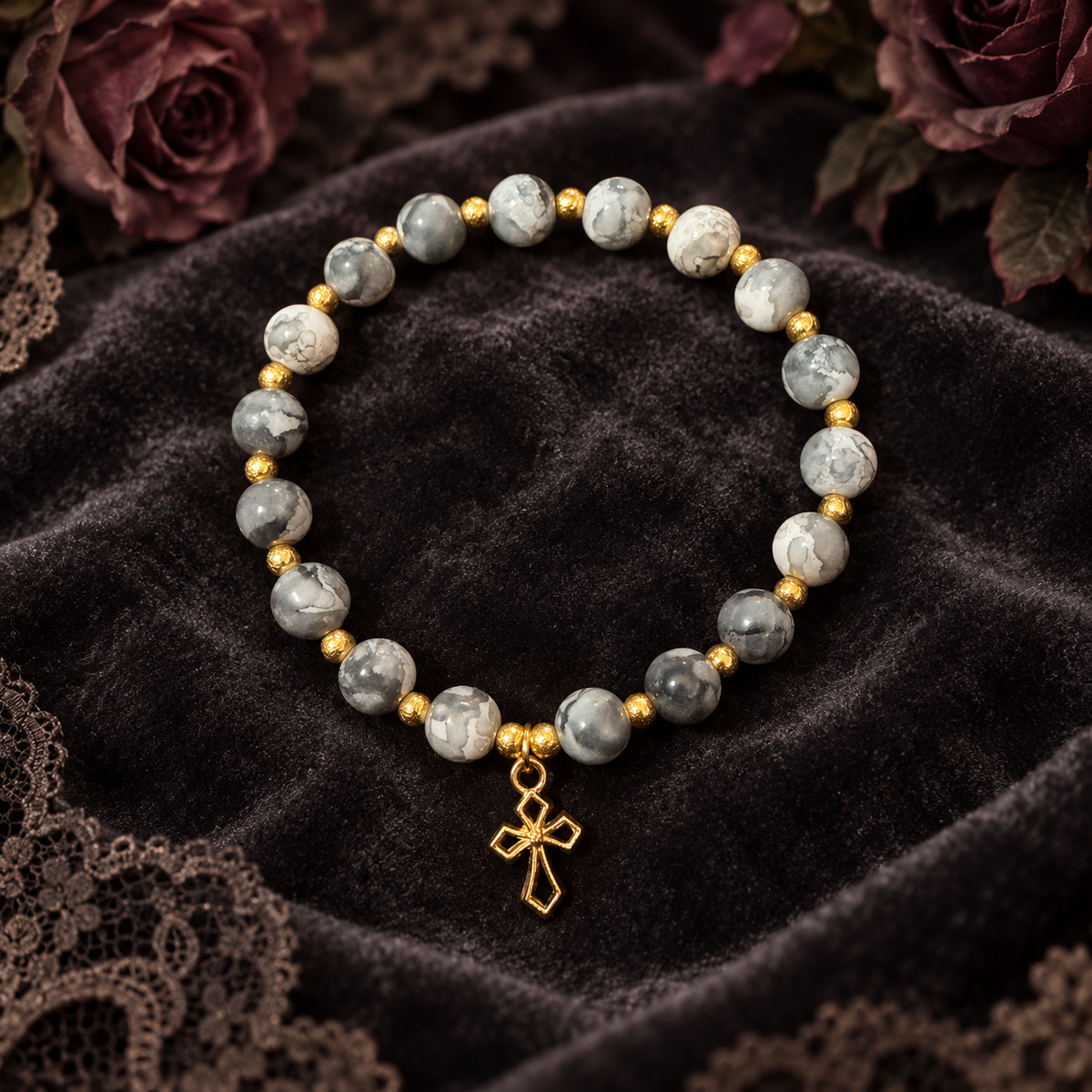 Black and white handcrafted glass bead bracelet with a gold cross charm