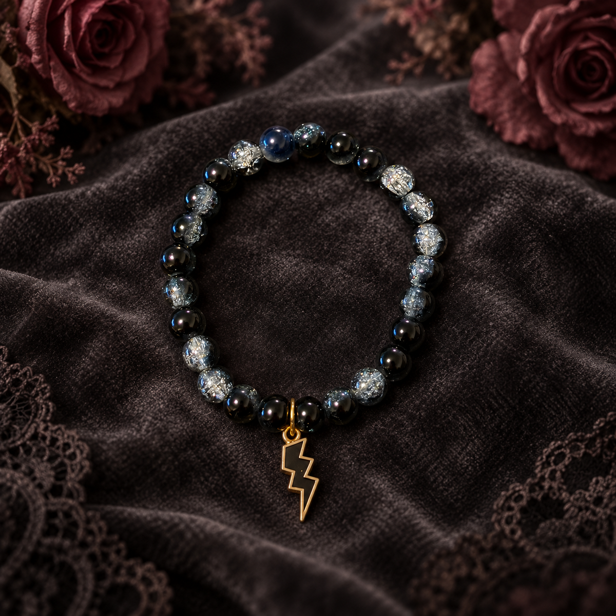 Black and white two tone handcrafted glass bead bracelet with a black lightning charm