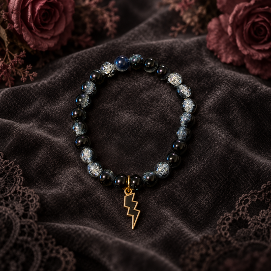 Black and white two tone handcrafted glass bead bracelet with a black lightning charm