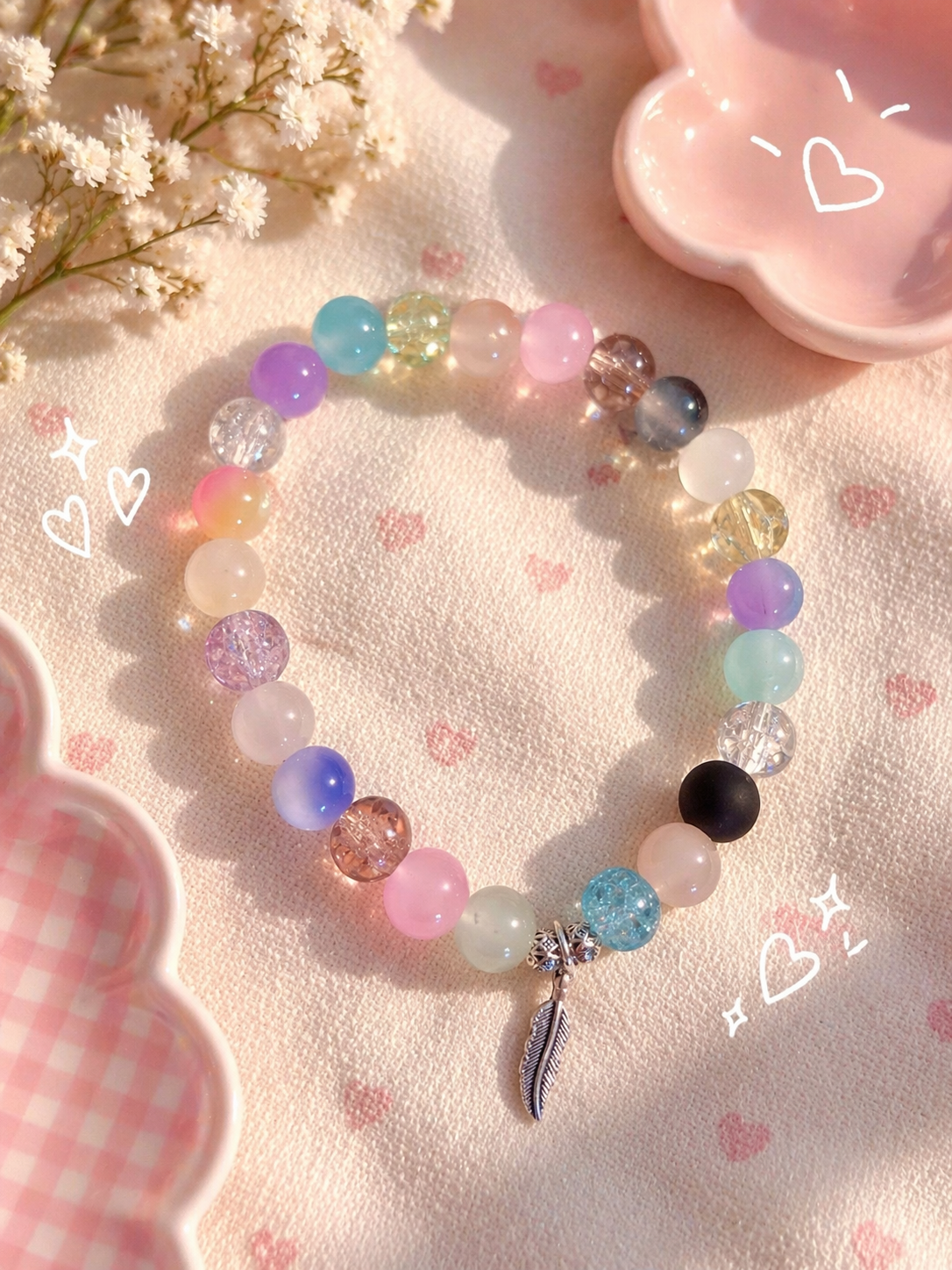 Sea breeze handcrafted glass bead bracelet random coloured beads with a feather charm