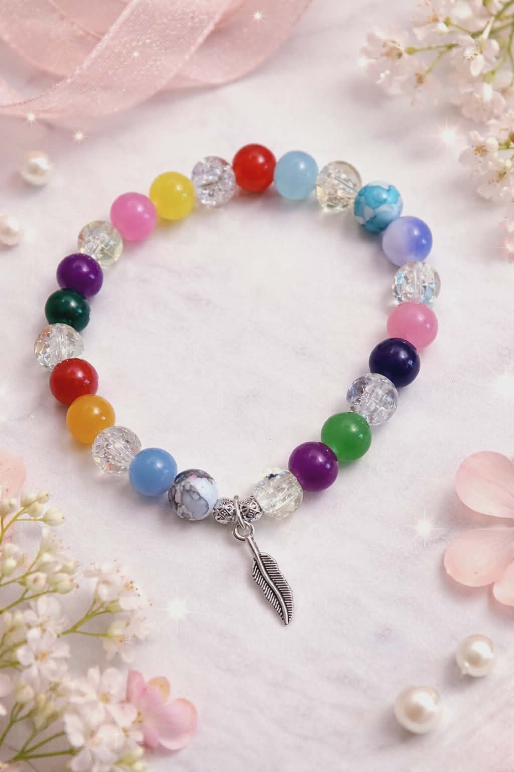 Crystal handcrafted glass bead bracelet random coloured beads with a feather charm