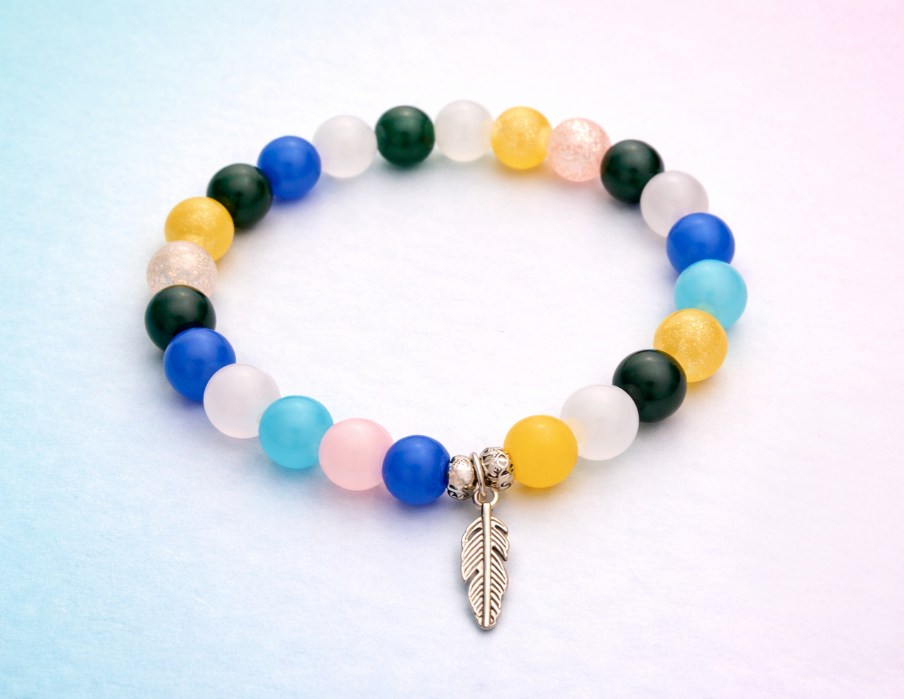 Rainy handcrafted glass bead bracelet random coloured beads with a feather charm